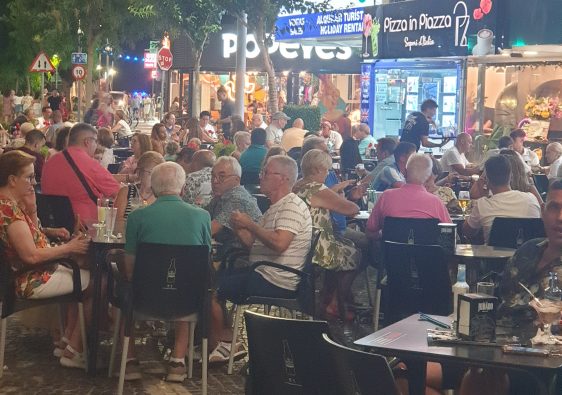 Busy Placa Triangular terraces at night in Benidorm