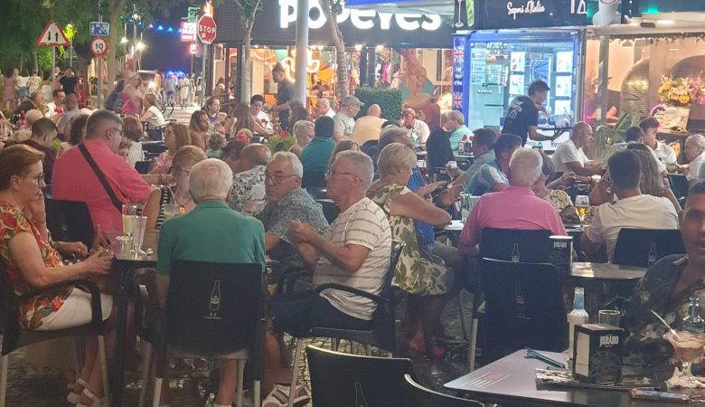 Busy Placa Triangular terraces at night in Benidorm