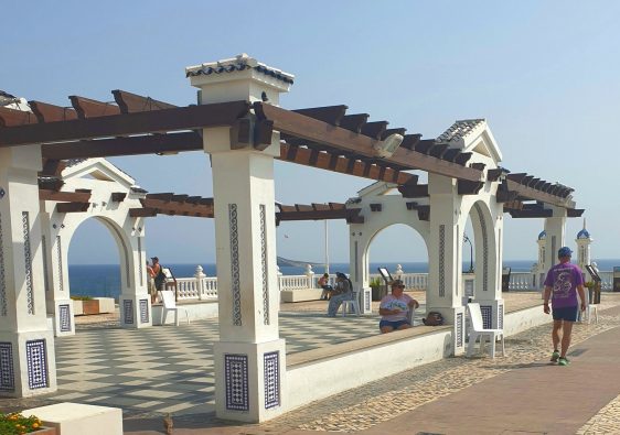 The tiled pergola and chequered promenade of the Balcón del Mediterráneo at the top of Benidorm Old Town, looking out to sea