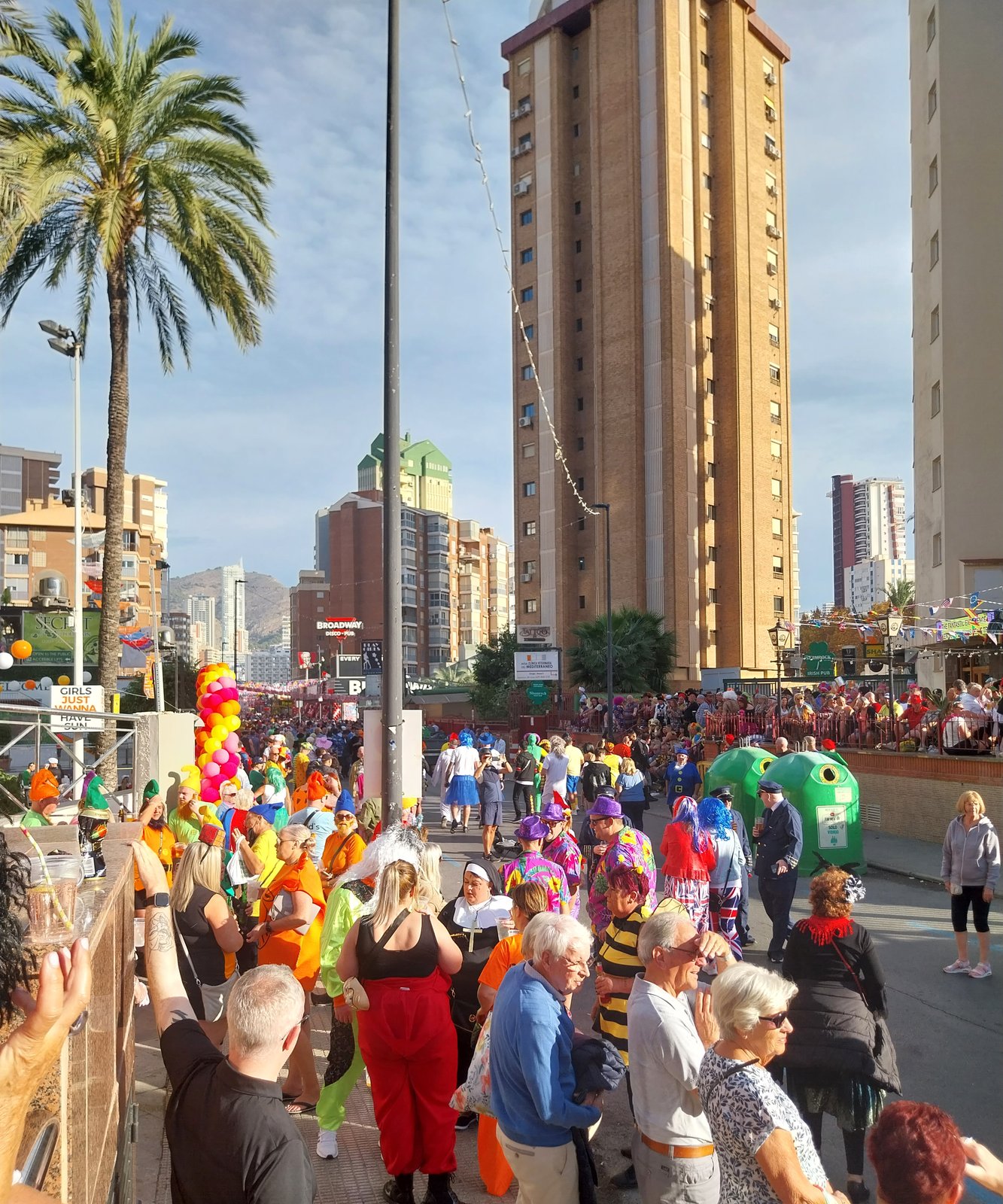 Crowds in fancy dress filling the street in the Benidorm New Town on fancy dress day