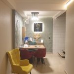 Emily Suites reception in Benidorm Old Town, yellow armchair and lit sign