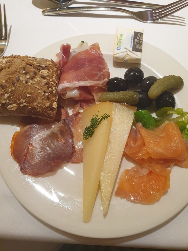 Plate of ham, cheese, smoked salmon and olives from the H10 Porto Poniente buffet