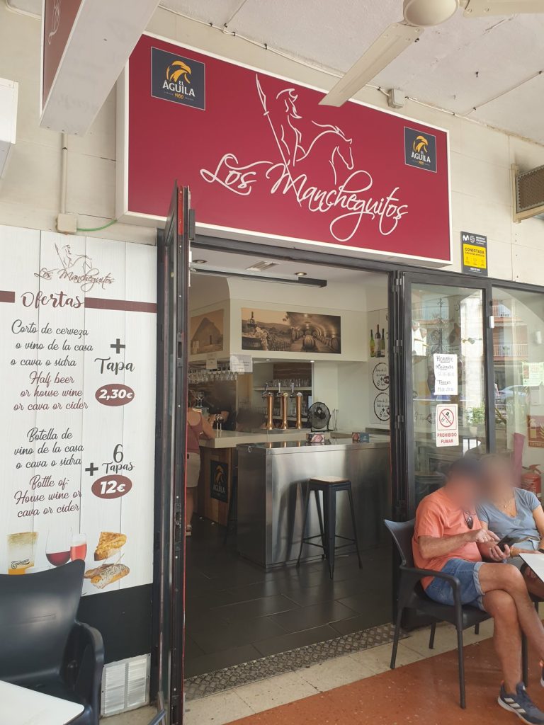 Front of Los Mancheguitos bar in Benidorm Old Town with its offers board