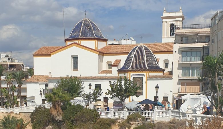 The church of Sant Jaume i Santa Anna with its blue-tiled domes, on the headland at the top of Benidorm Old Town