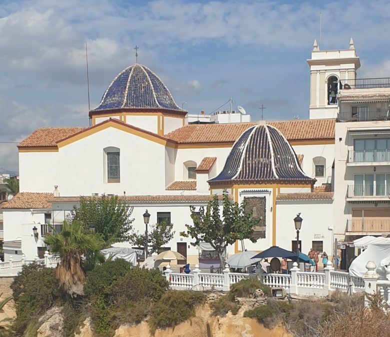 The church of Sant Jaume i Santa Anna with its blue-tiled domes, on the headland at the top of Benidorm Old Town